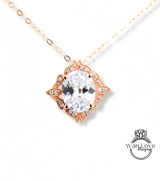 A necklace with a large, clear gemstone pendant, surrounded by an ornate, decorative design.