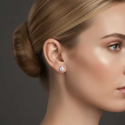 A close-up of a woman's face, focusing on her earrings and hair.