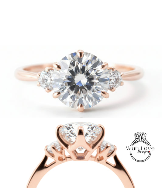 a beautiful rose gold engagement ring with a large, brilliant-cut diamond set in the center, surrounded by smaller diamonds. The ring is designed with a three-pronged band and a halo of smaller diamonds on either side of the central diamond.