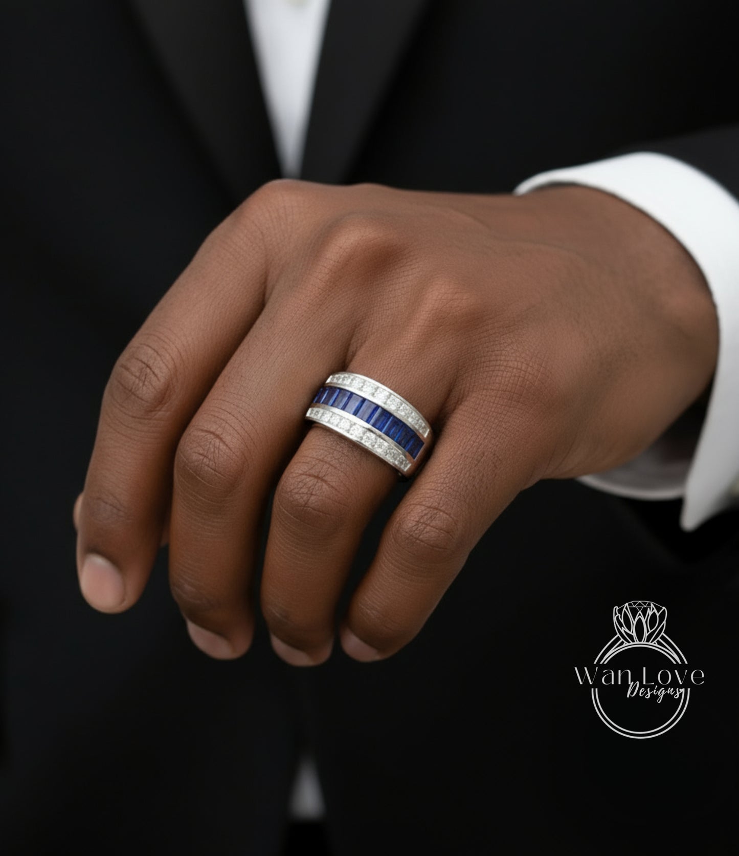 A close-up of a person's hand wearing a ring with blue and white stones.