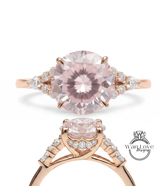 a beautiful pink gemstone engagement ring with a delicate rose gold band and intricate detailing.
