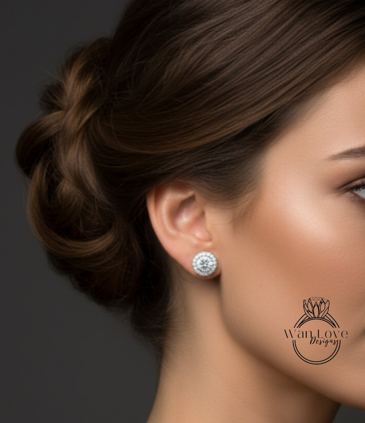 A close-up of a woman's face, focusing on her earrings and hair.