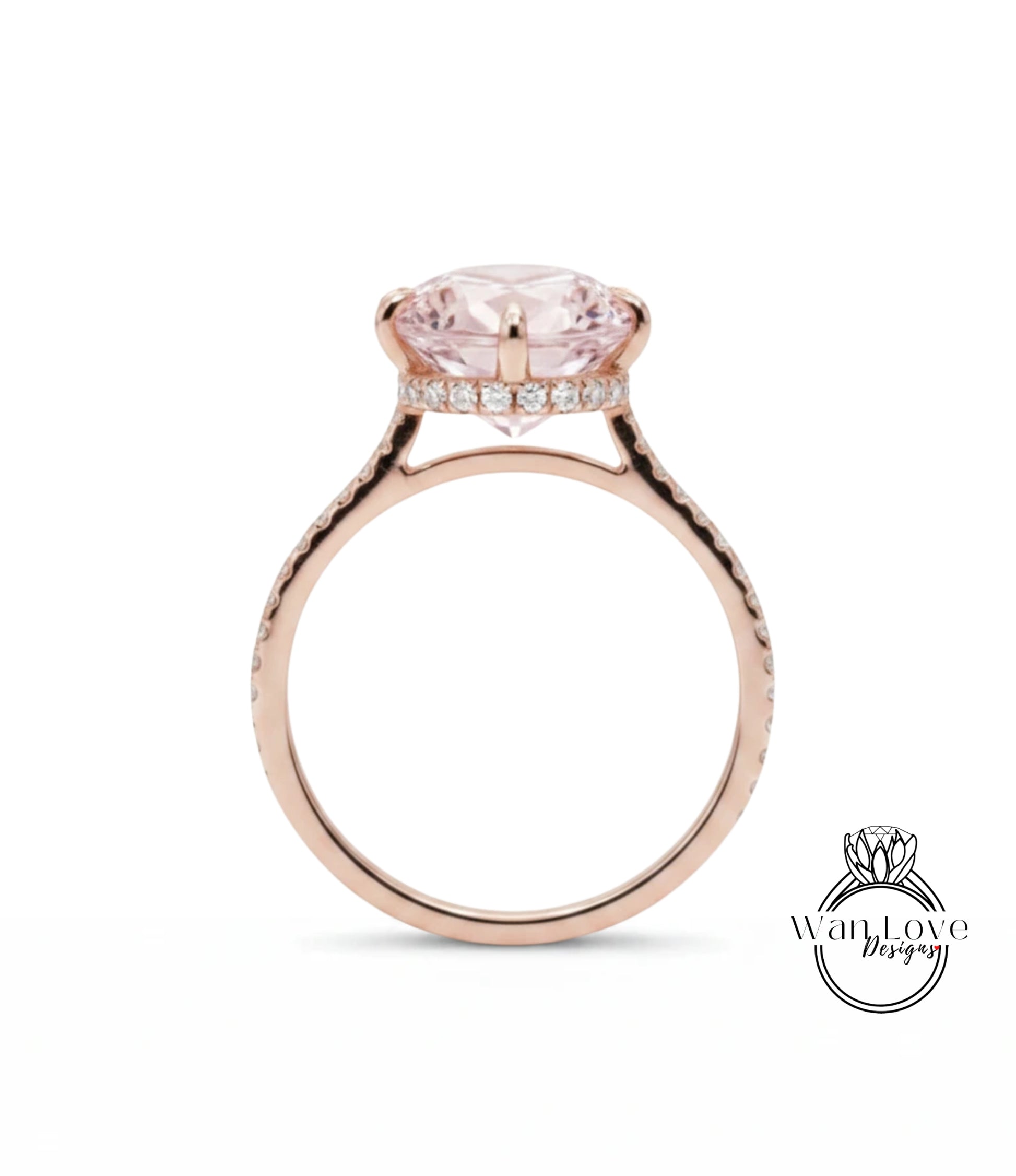 A rose gold engagement ring with a large pink gemstone set in the center, surrounded by a halo of smaller diamonds.