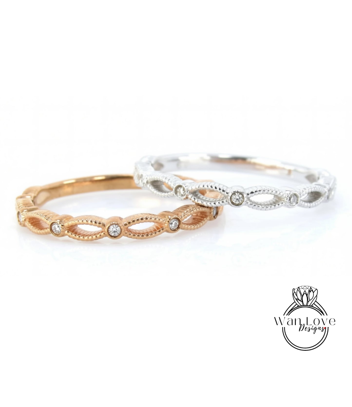 Two rings with diamonds set in a decorative pattern, one in gold and one in silver.