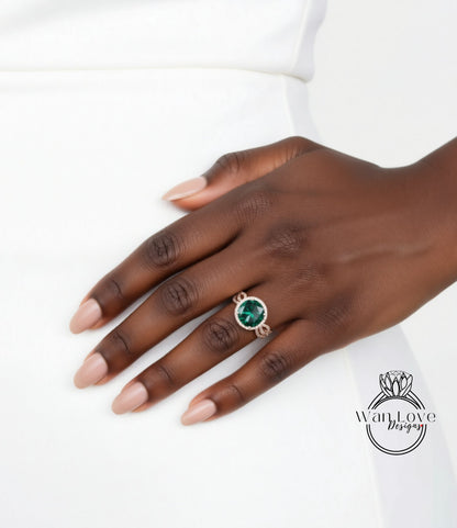 A close-up of a hand wearing a ring with a green gemstone.