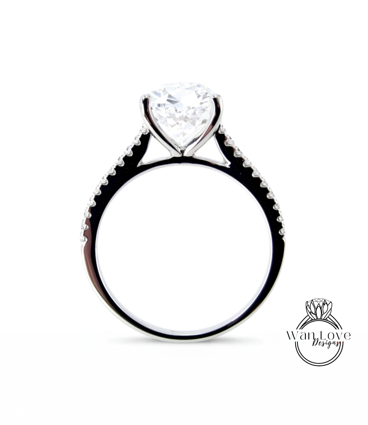 A close-up view of a diamond engagement ring with a large central diamond and smaller diamonds along the band.