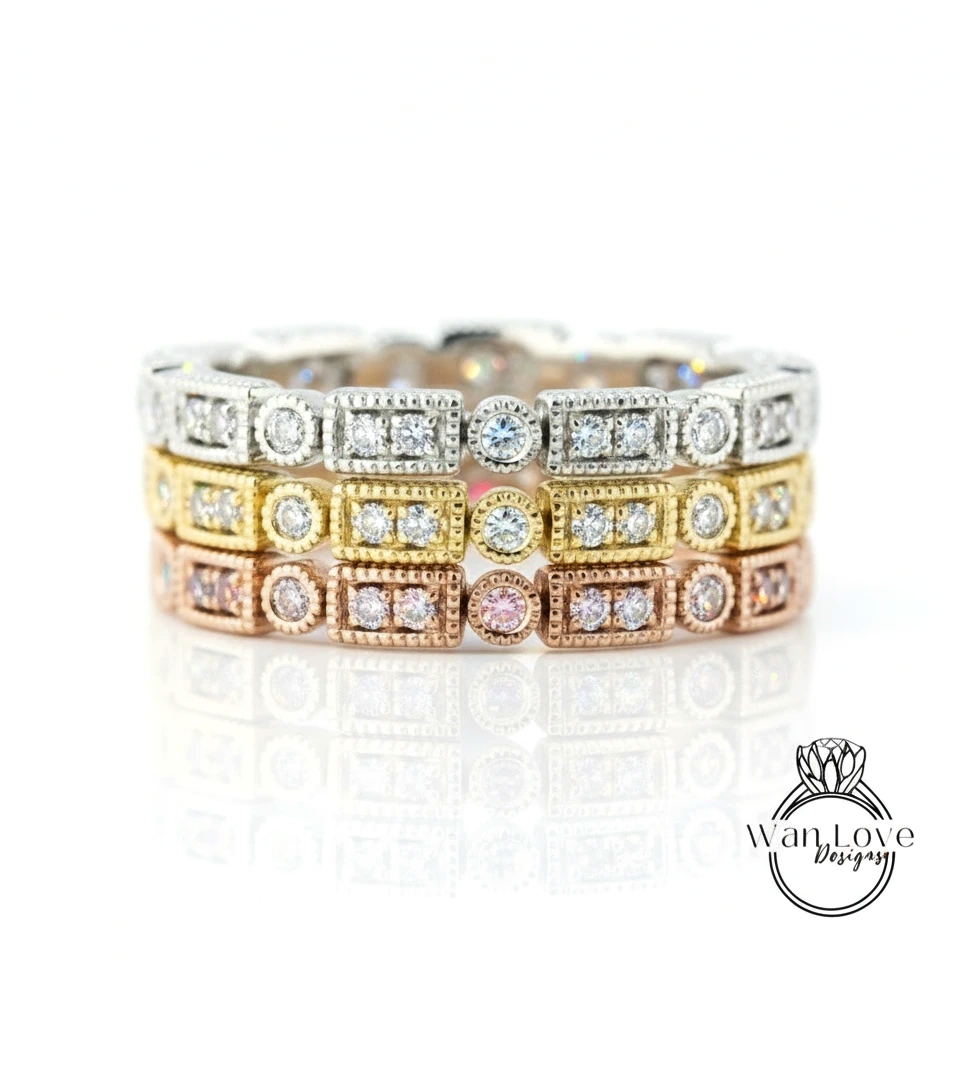 A close-up image of a ring with multiple layers of diamond-encrusted rings, showcasing the intricate design and sparkling gemstones.