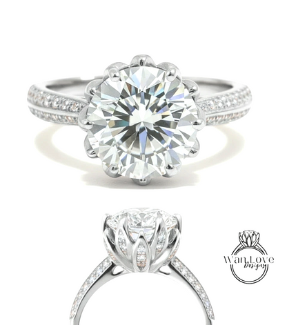 A stunning diamond engagement ring with a large round brilliant cut diamond set in a silver band adorned with small diamonds.