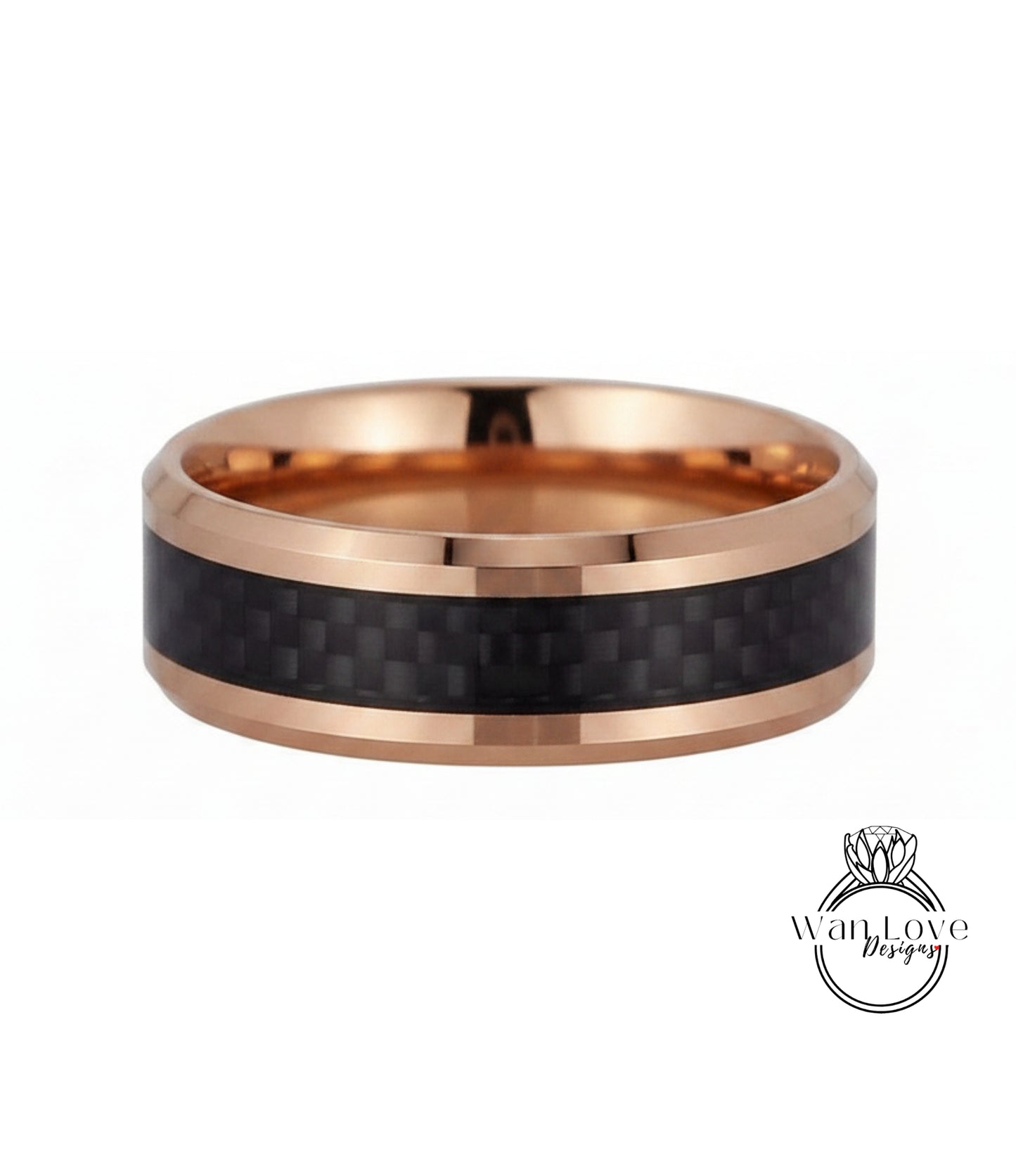A gold-toned ring with a black carbon fiber band, showcasing a unique and stylish design.