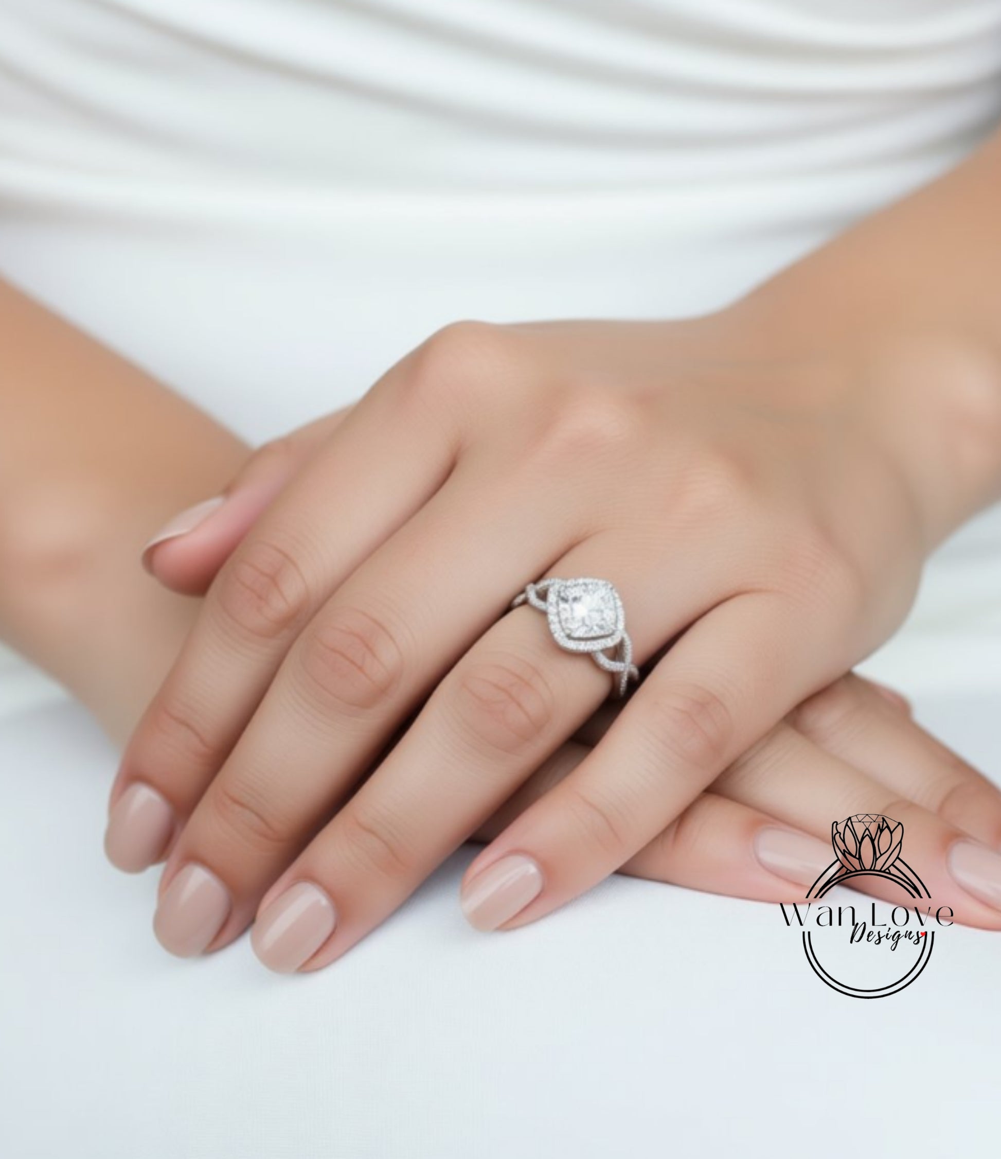 A close-up of a person's hand wearing a diamond engagement ring.