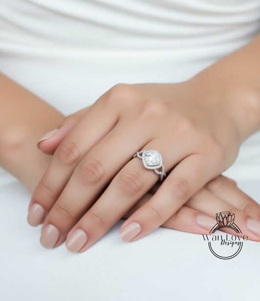 A close-up of a person's hand wearing a diamond engagement ring.