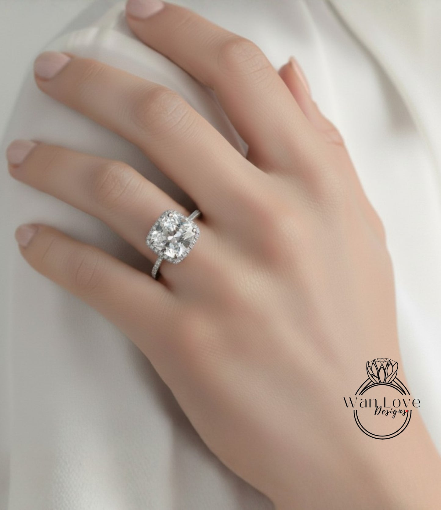 A close-up of a hand wearing a large diamond engagement ring.