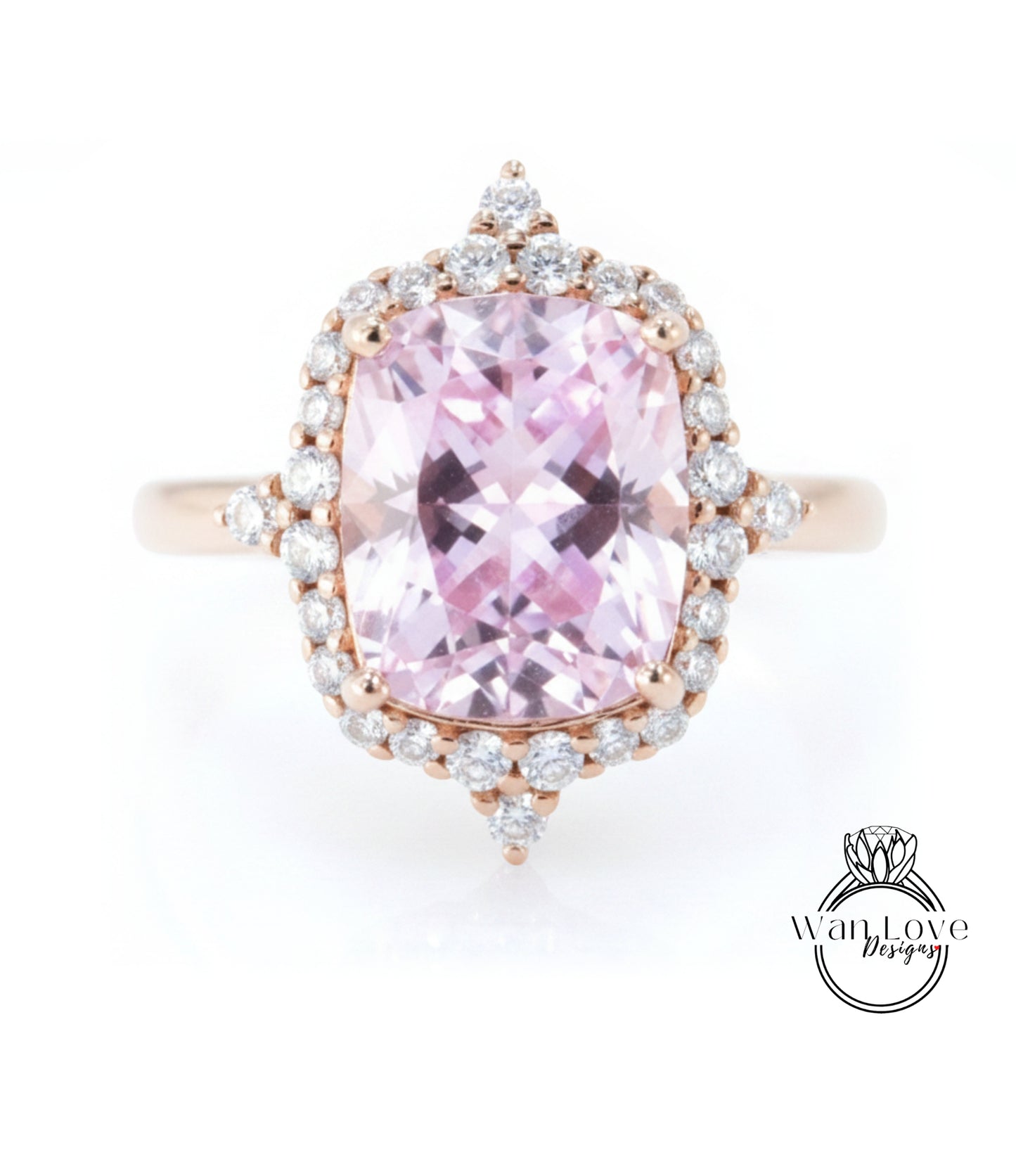 A beautiful pink gemstone ring with a large central gemstone surrounded by smaller diamonds set in a halo of smaller diamonds.