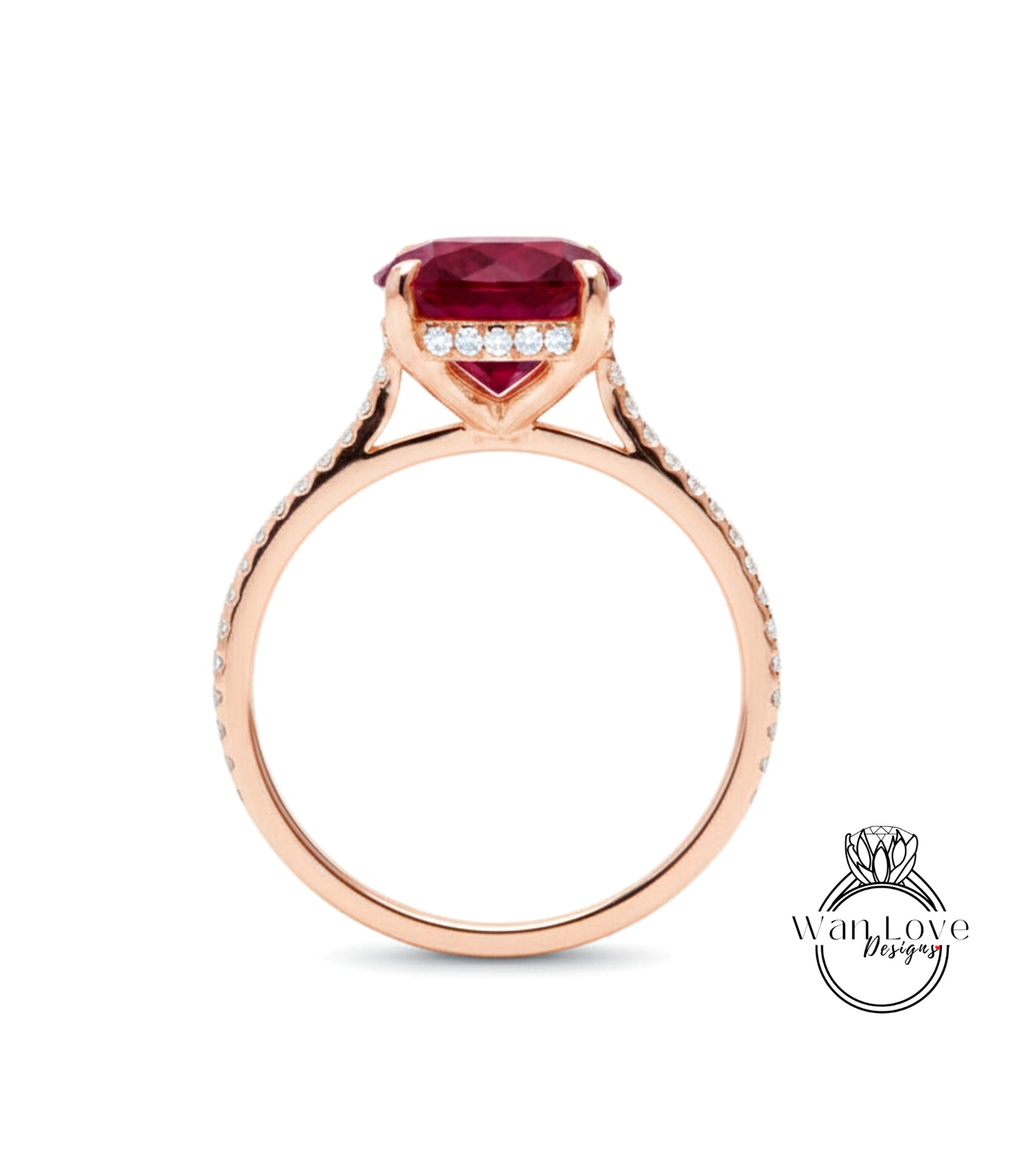 A rose gold engagement ring with a large red gemstone and small diamonds set in the band.
