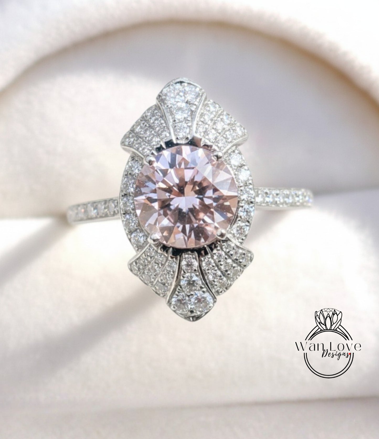 A close-up image of a diamond engagement ring with a large, round pink gemstone surrounded by smaller diamonds and a halo of smaller diamonds.