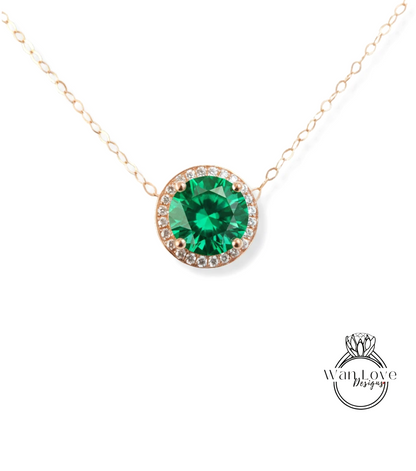 A necklace with a large, green gemstone at the center, surrounded by smaller diamonds.