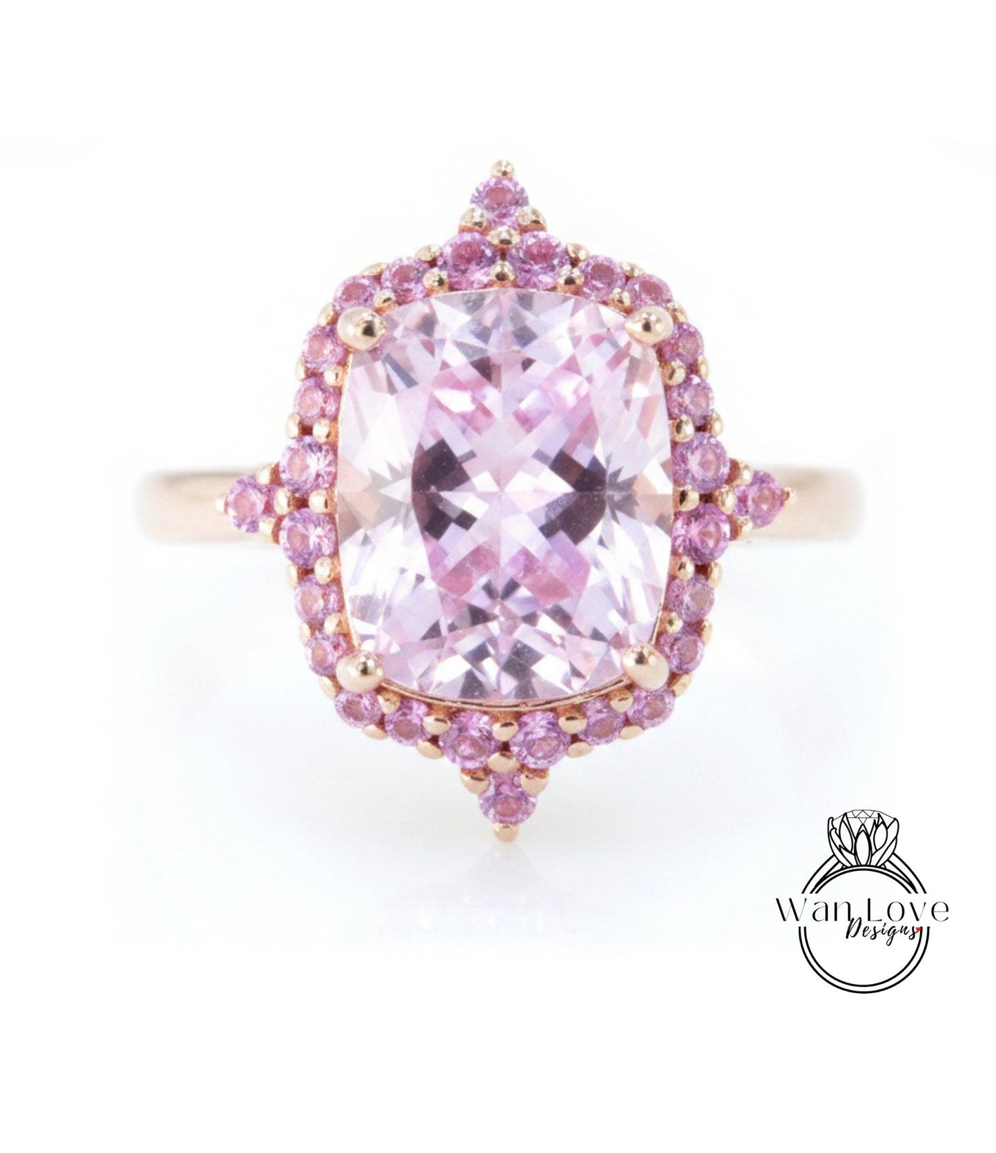 A pink gemstone ring with a large central gemstone surrounded by smaller pink gemstones.