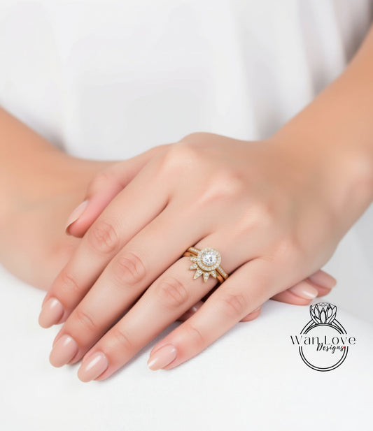 A close-up of a person's hand wearing a gold ring with a large diamond center stone.