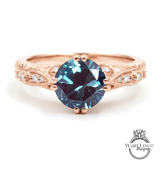 a rose gold engagement ring with a large blue gemstone set in the center.