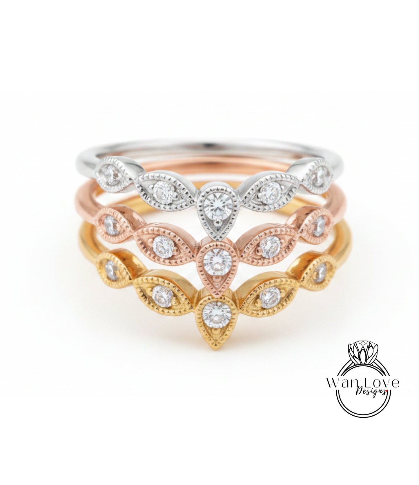 A ring with multiple tiers of diamond-encrusted designs, featuring a combination of gold, silver, and pink tones.