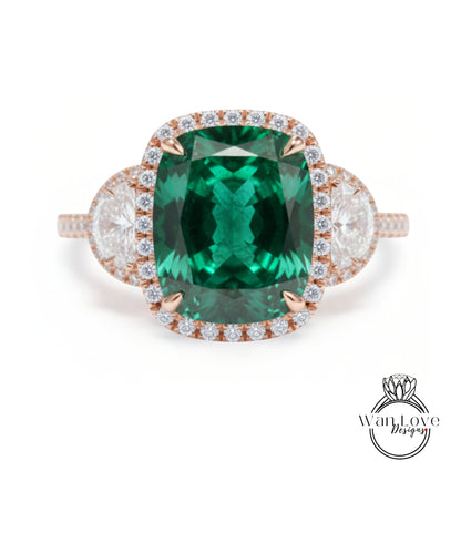 A large, oval-shaped green gemstone set in a halo of smaller diamonds, surrounded by a ring band with smaller diamonds.