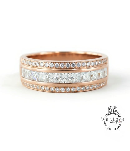 A rose gold ring with a row of diamonds set in the band.