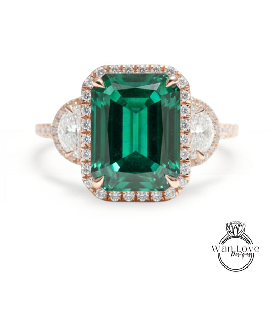 A large, green gemstone ring with a halo of smaller diamonds around the center stone.