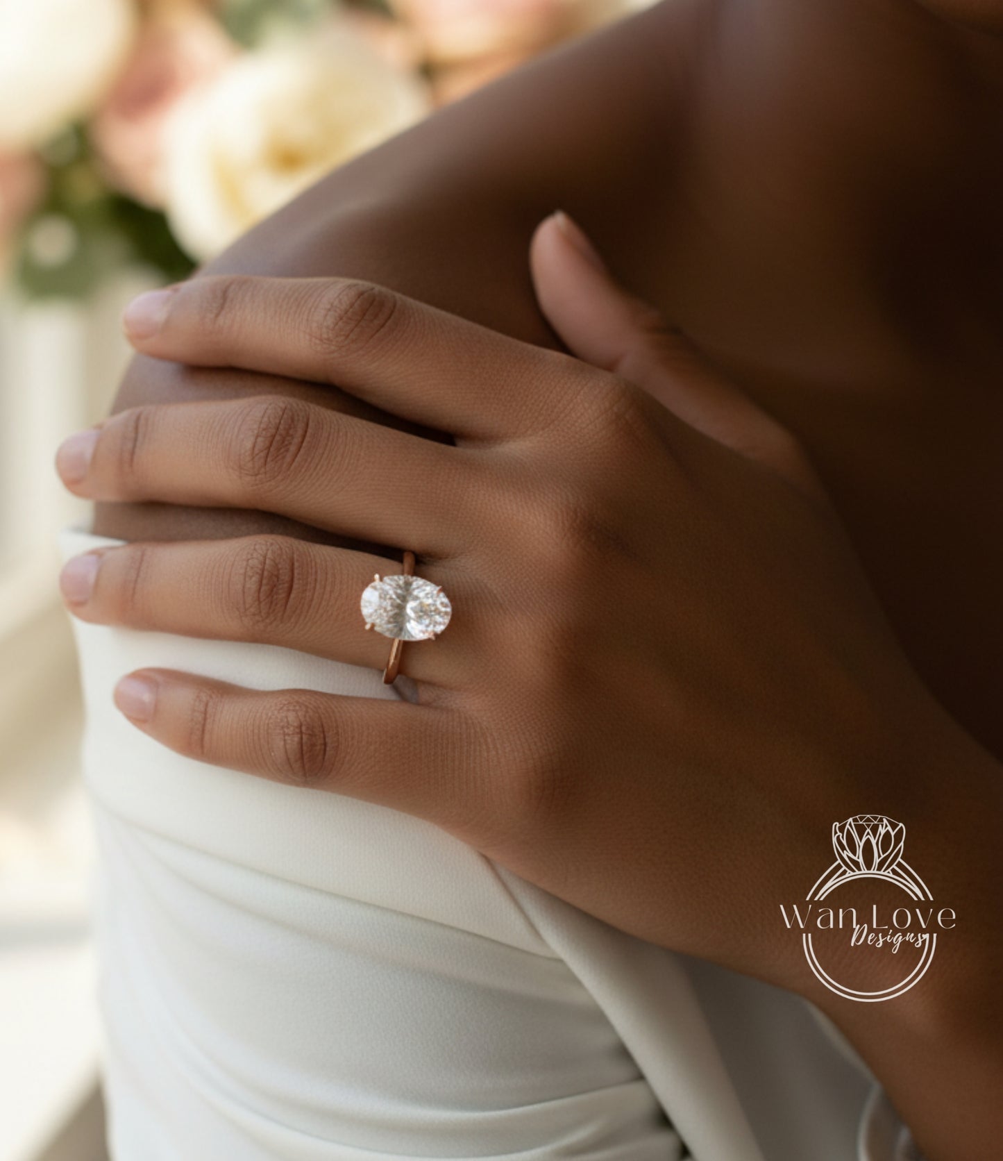 A close-up of a person's hand wearing a large, round diamond engagement ring.