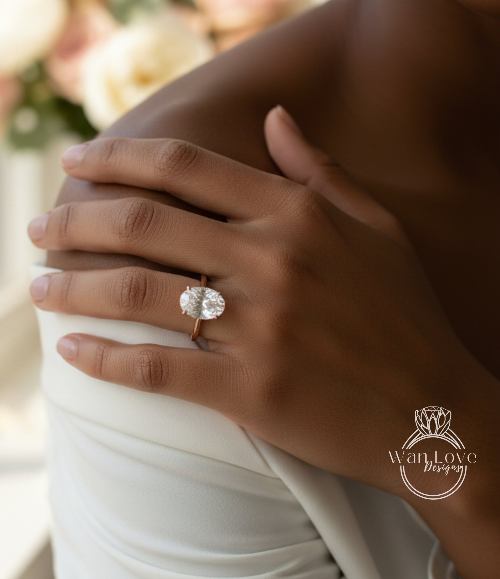 A close-up of a person's hand wearing a large, round diamond engagement ring.