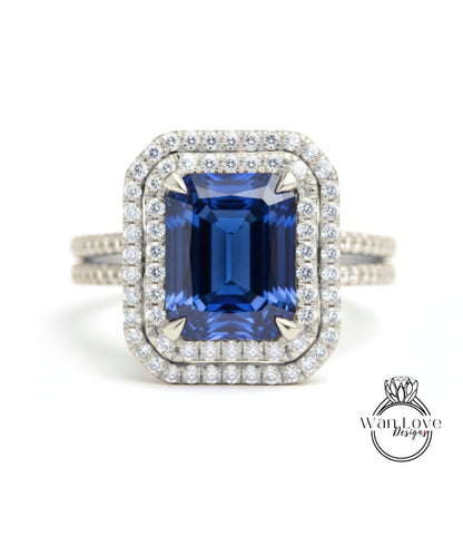 A stunning diamond ring with a large blue gemstone set in a halo of smaller diamonds, showcasing the intricate craftsmanship and attention to detail.