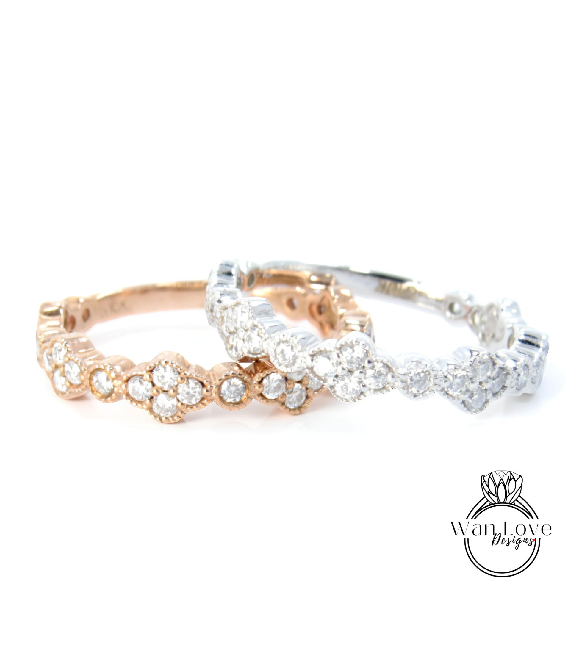 two rings with a combination of gold and silver tones, adorned with numerous small diamonds.