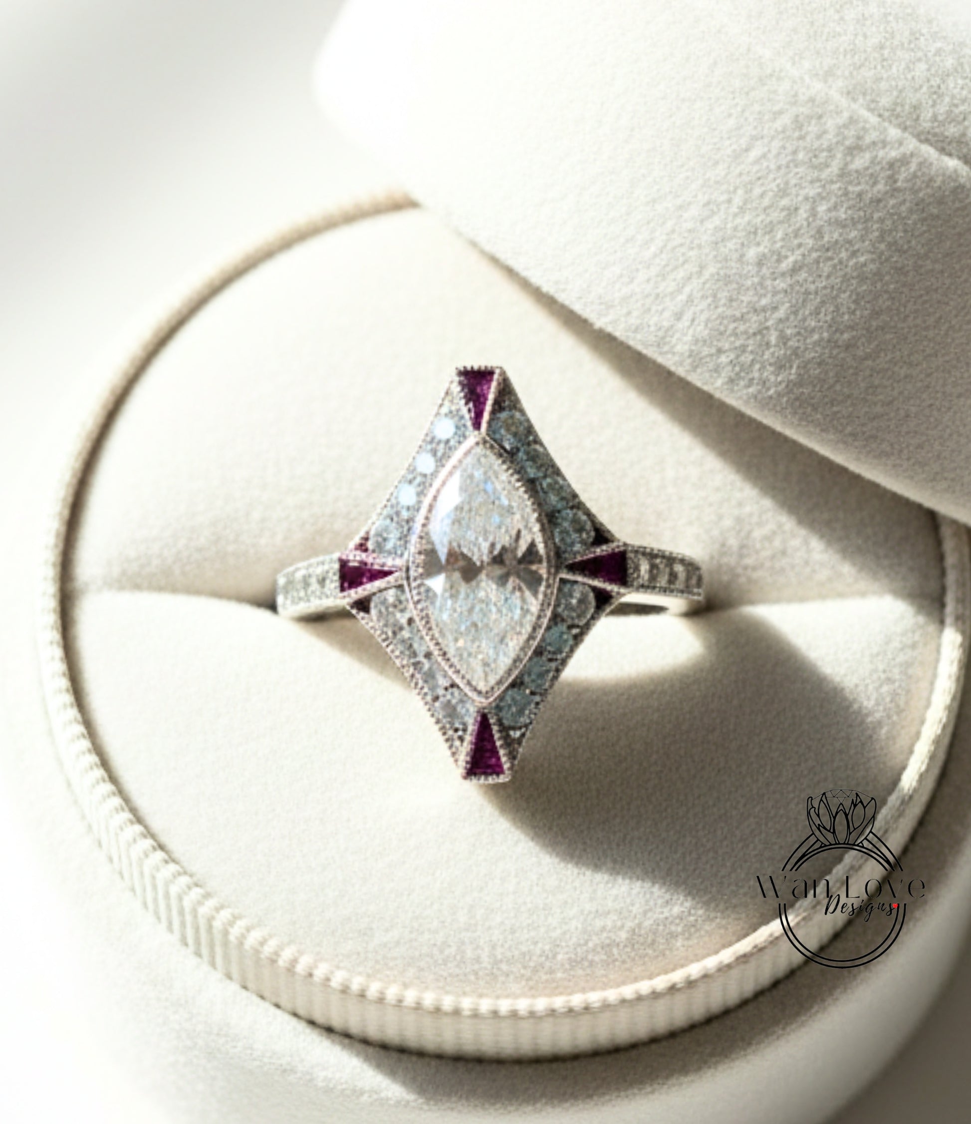 A diamond engagement ring is displayed in a white jewelry box, showcasing its intricate design and sparkling gemstones.