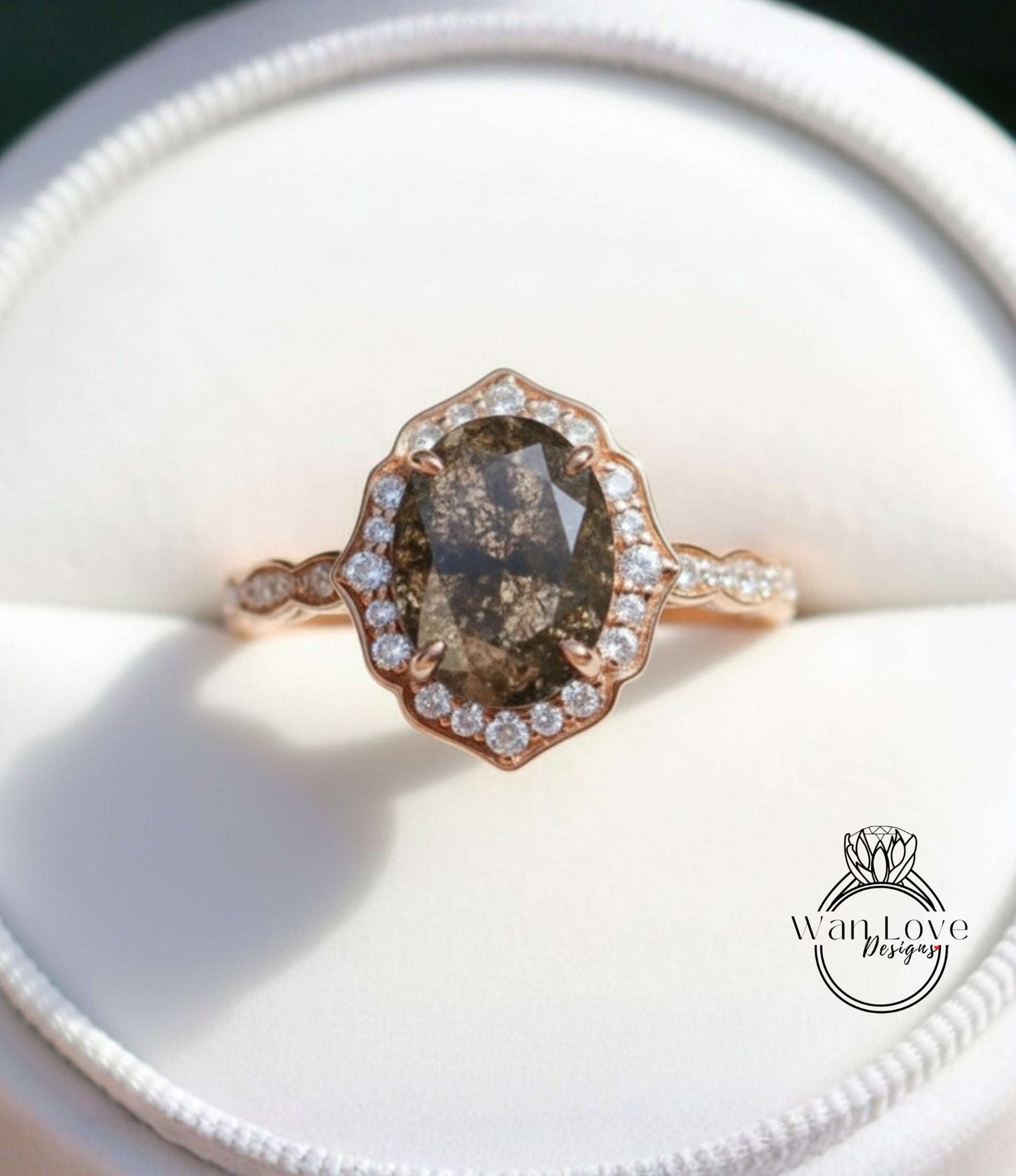 A close-up image of a gold ring with a large oval-shaped diamond at the center, surrounded by smaller diamonds.