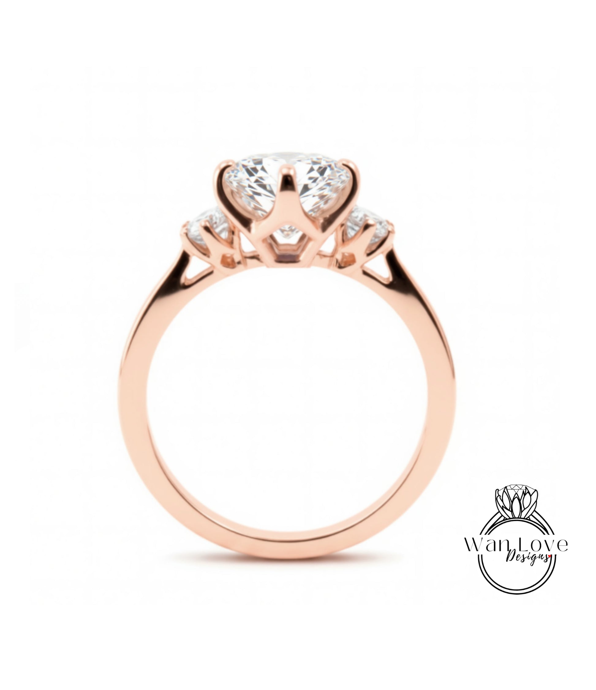 A rose gold engagement ring with a large central diamond and smaller diamonds on either side.