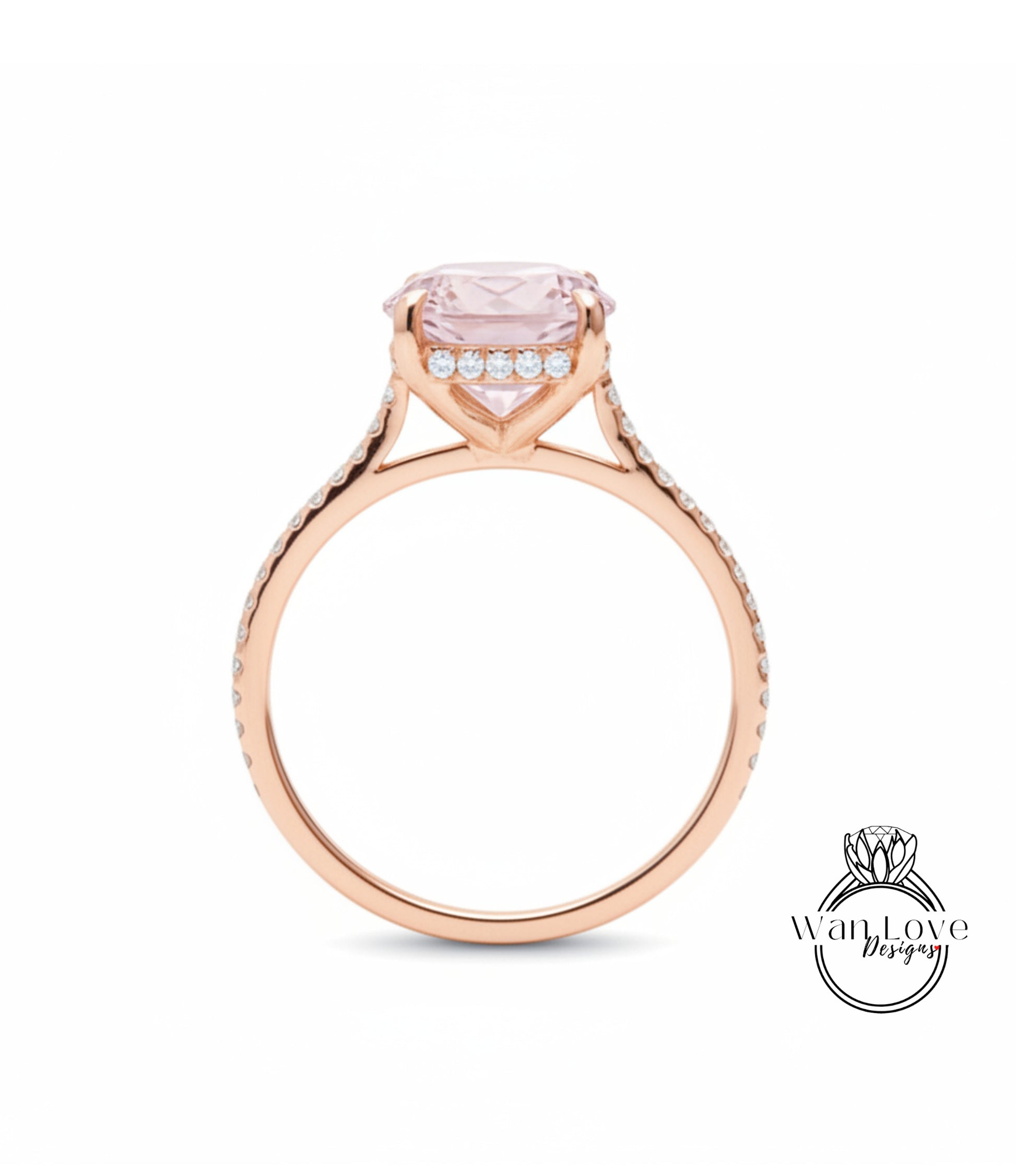 A rose gold engagement ring with a large pink gemstone set in the center, surrounded by smaller diamonds.