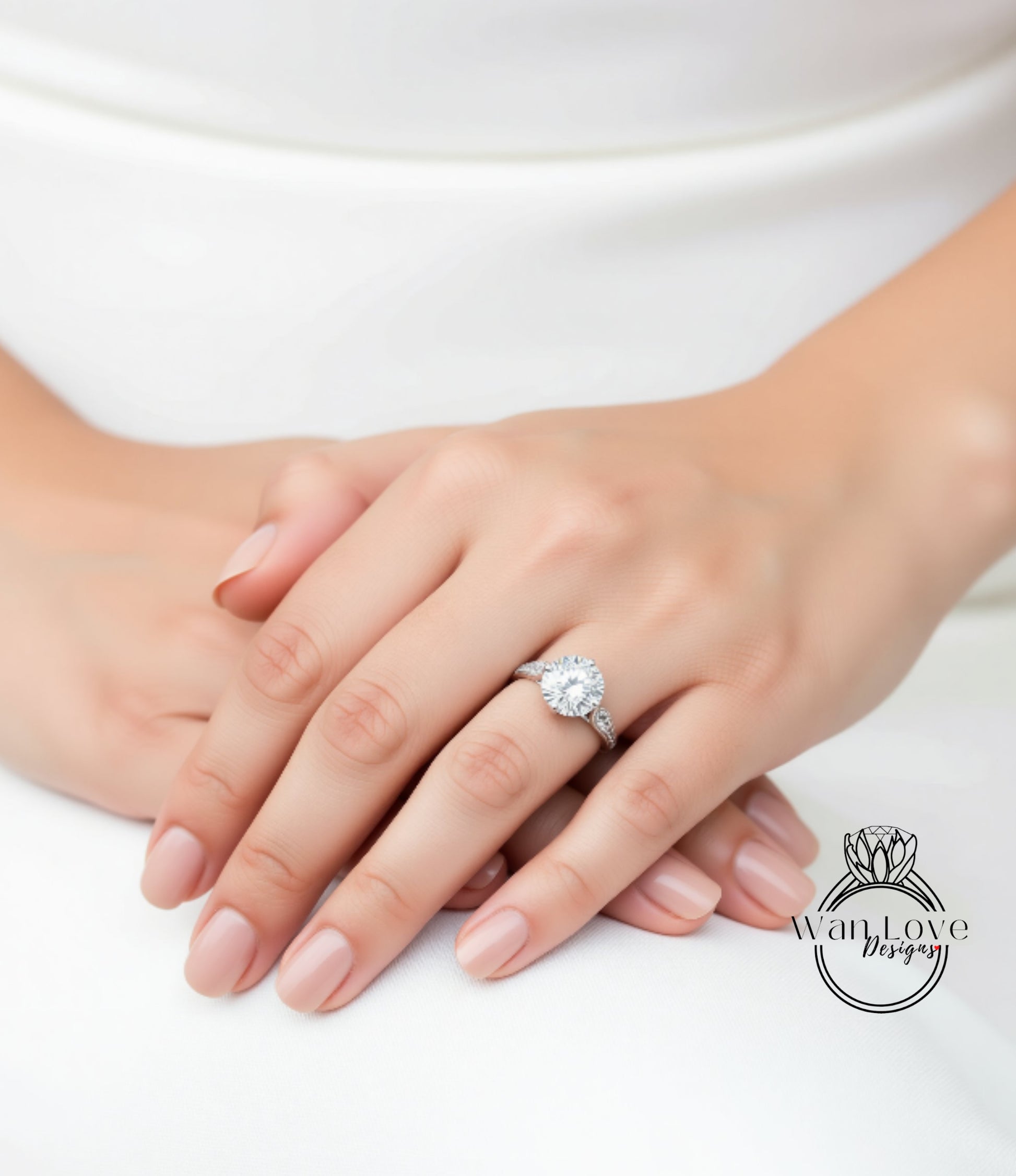 A close-up of a person's hand wearing a diamond engagement ring.