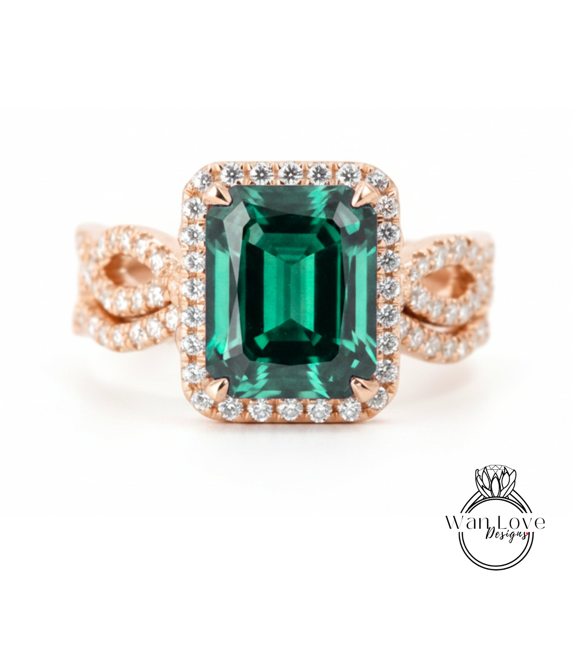 A large, green gemstone ring with a halo of smaller diamonds around the center stone.