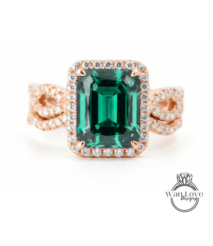 A large, green gemstone ring with a halo of smaller diamonds around the center stone.