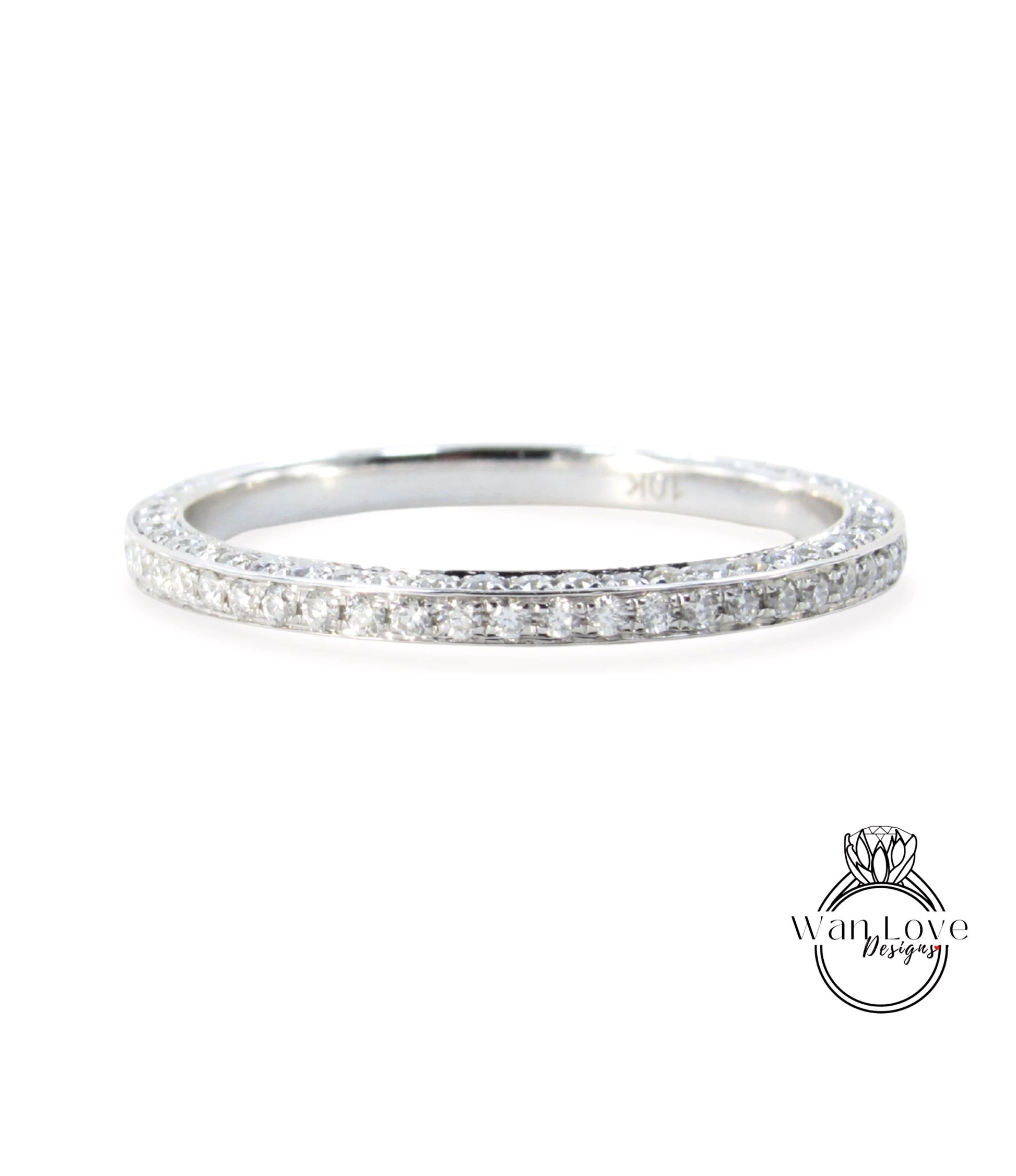 A silver band ring with a row of small diamonds set in it.