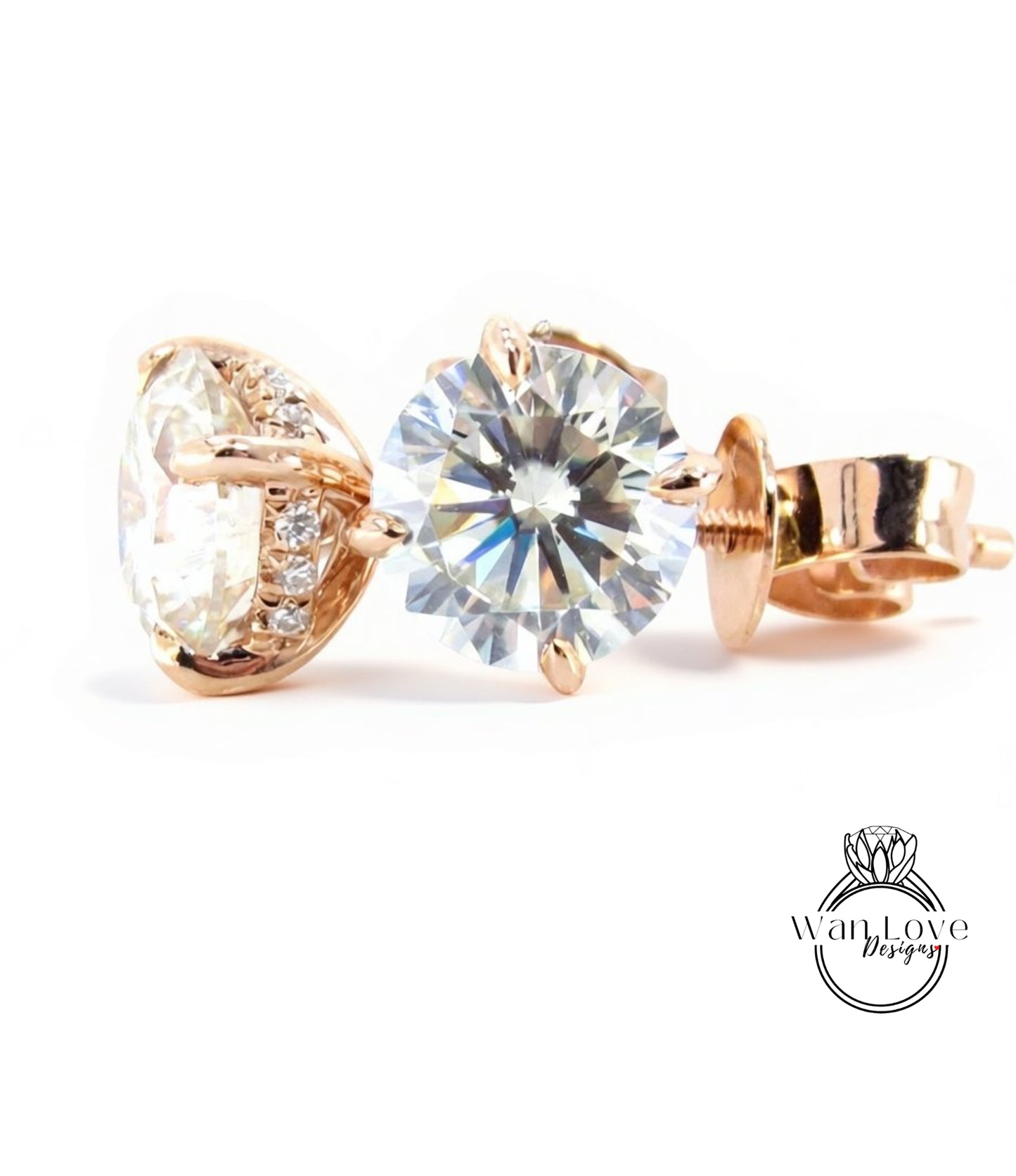 A close-up image of a pair of gold-toned earrings with a large, clear diamond set in the center.