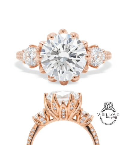 a beautiful engagement ring with a large, round diamond set in a rose gold band. The ring has three smaller diamonds on either side of the large central diamond, and the band is adorned with a delicate floral design.