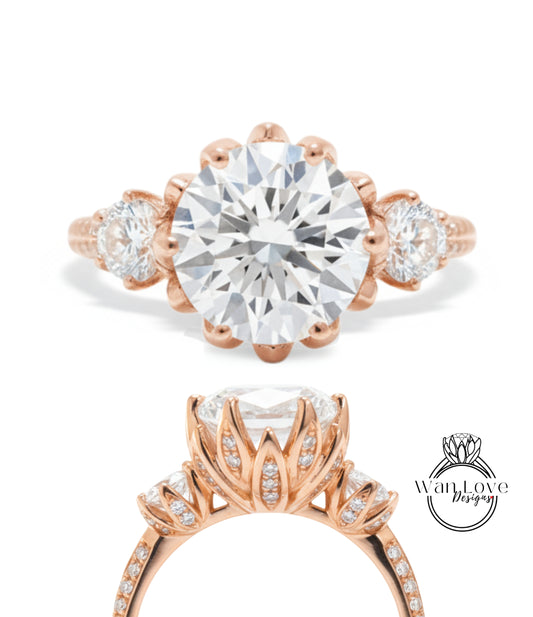 a beautiful engagement ring with a large, round diamond set in a rose gold band. The ring has three smaller diamonds on either side of the large central diamond, and the band is adorned with a delicate floral design.