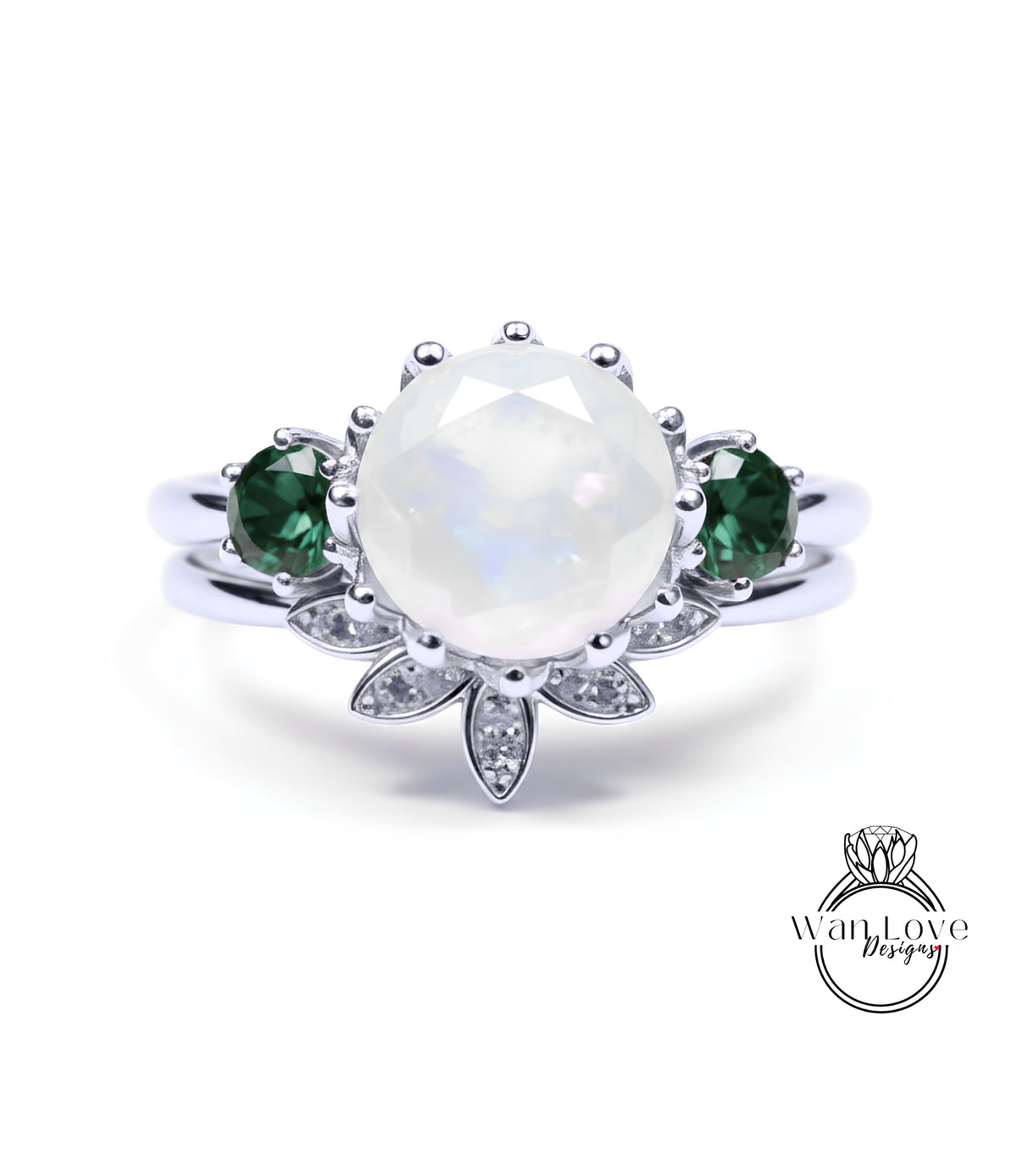 A silver ring with a large oval-shaped gemstone at the center, surrounded by smaller gemstones and a floral design.