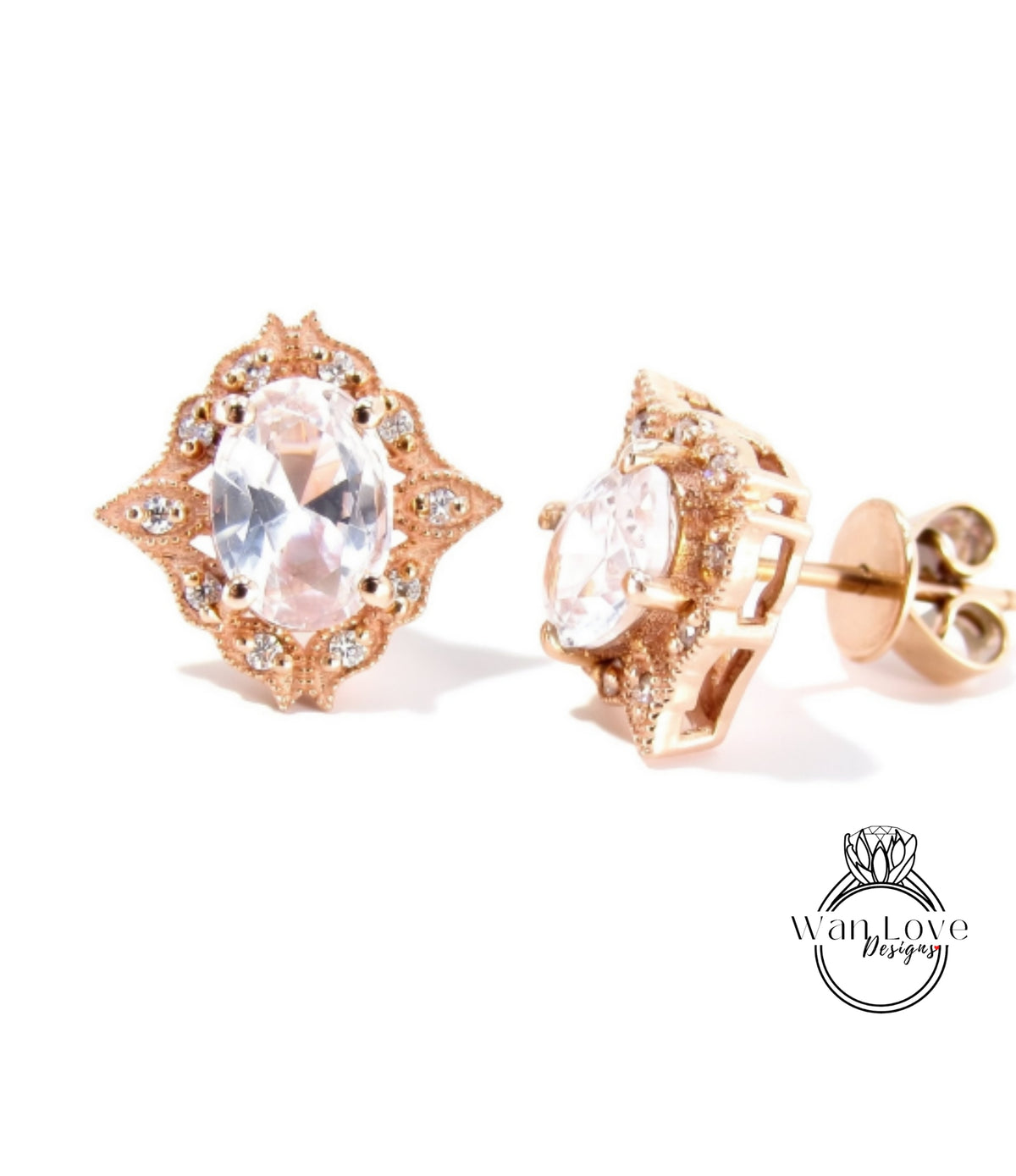 A pair of elegant gold earrings with a large oval-shaped gemstone set in a decorative pattern.