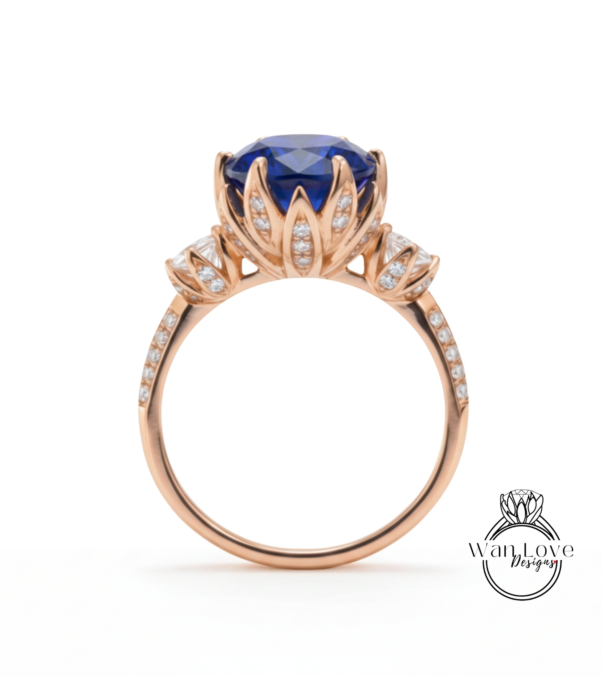 A gold ring with a large blue gemstone, likely a sapphire, at the center. The ring has a delicate floral design around the gemstone and is adorned with small diamonds.