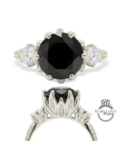 a silver ring with a large black gemstone, likely a diamond, as the centerpiece. The ring is adorned with multiple smaller diamonds set in the floral design.