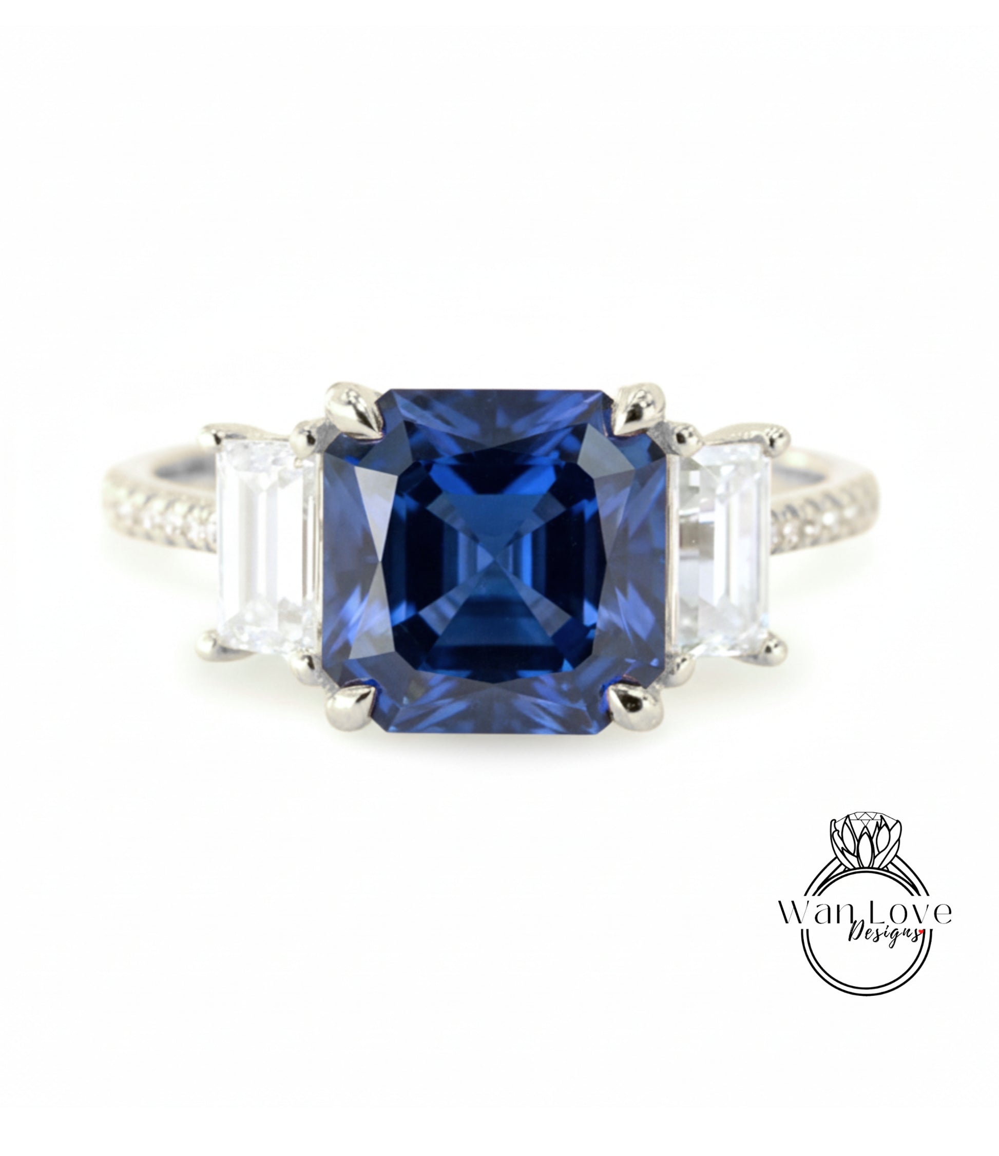 A close-up of a diamond ring with a large blue gemstone in the center, surrounded by smaller diamonds.