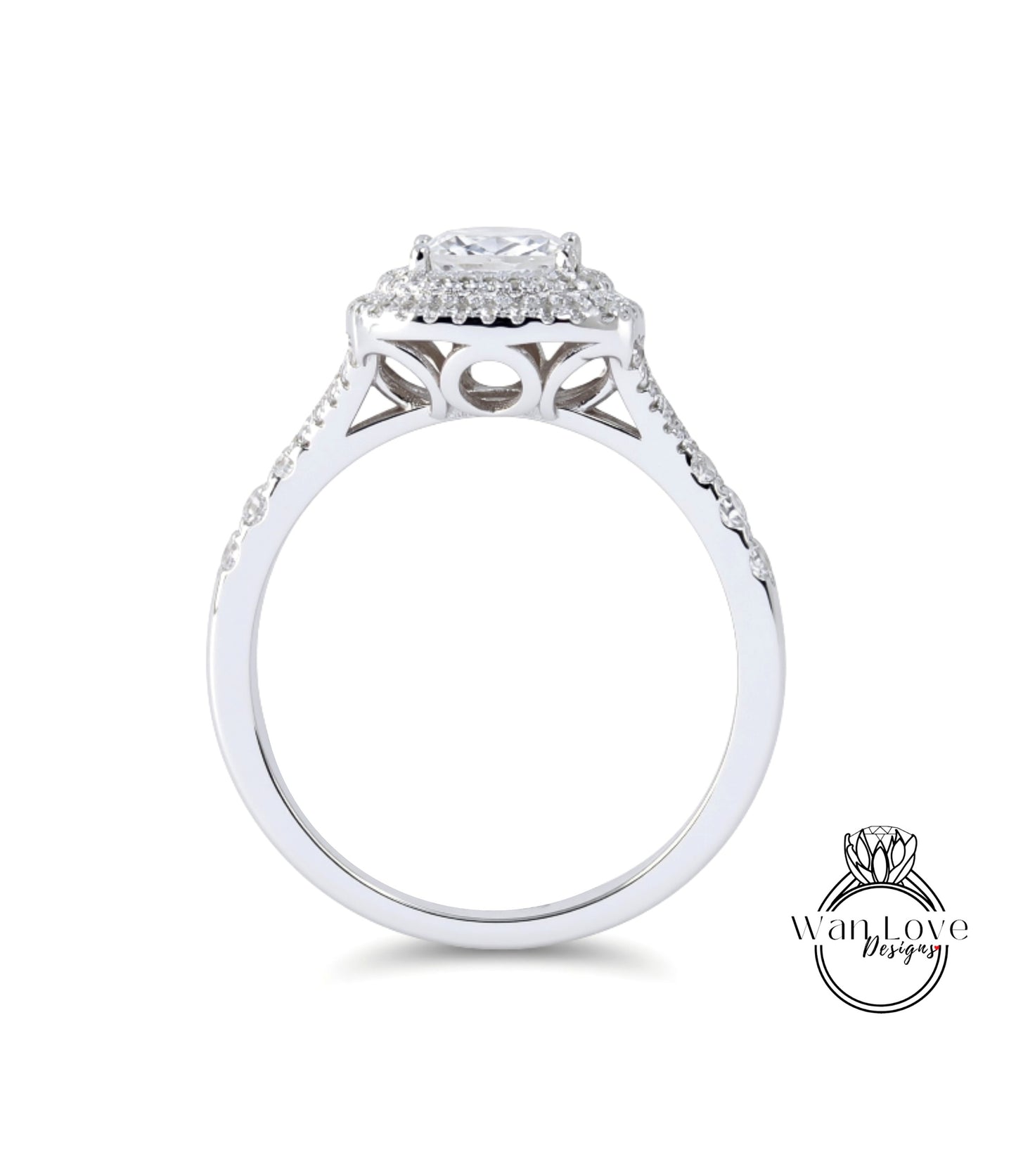A silver engagement ring with a large central diamond surrounded by smaller diamonds, set in a halo of smaller diamonds.