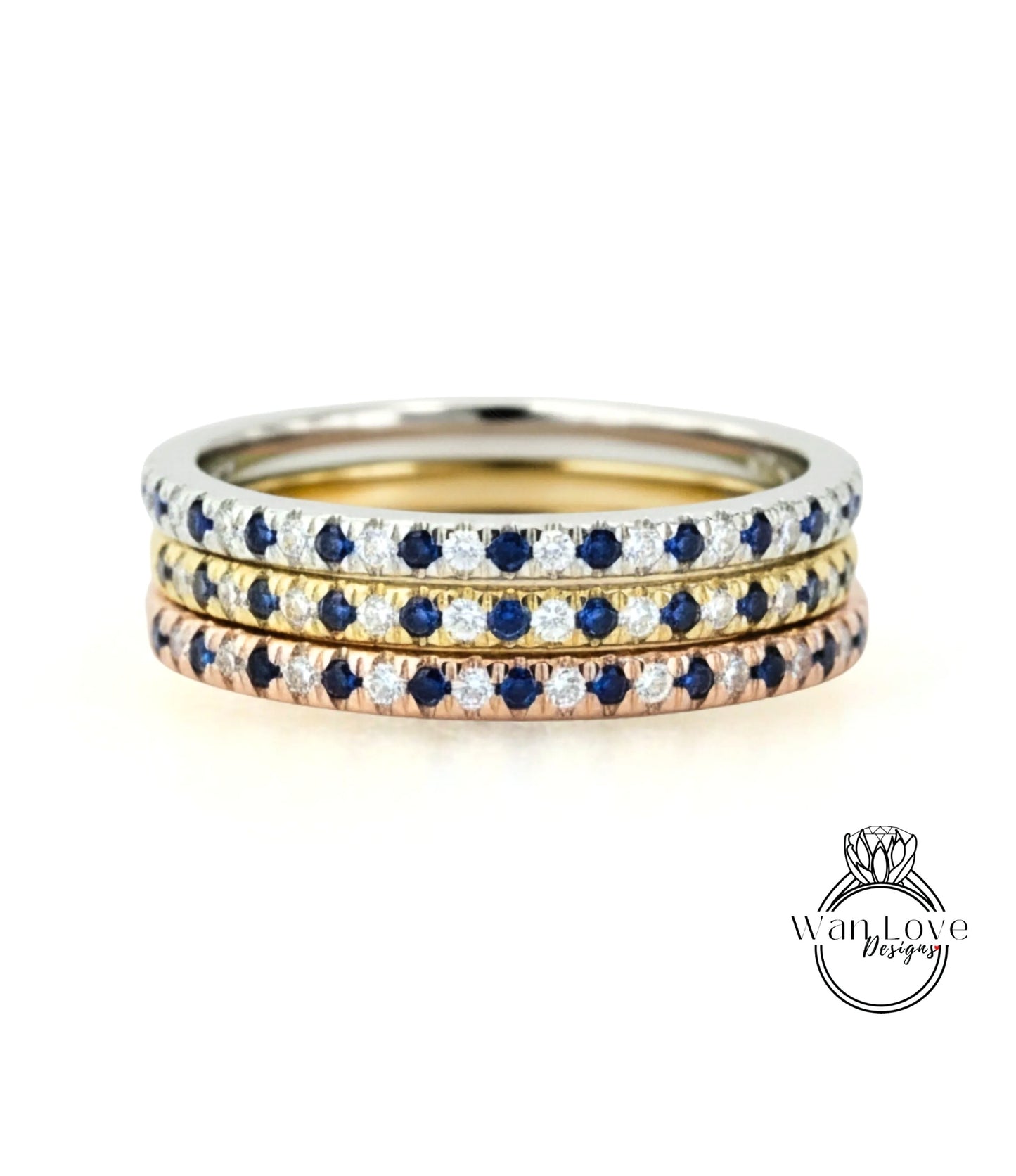 A stack of three rings with blue sapphires and diamonds set in a silver band.