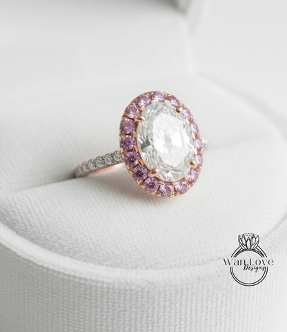 A close-up image of a diamond ring with a large oval-shaped diamond surrounded by a halo of smaller diamonds and colored gemstones.